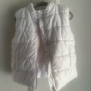 Toddler girl’s pale blush puffy vest, size 2